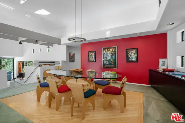 a very nice looking dining room with a table and chairs