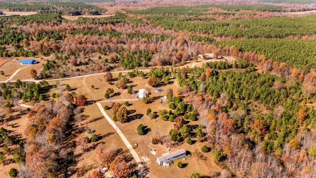 a bathroom with a sink a large mirror and a bathtub