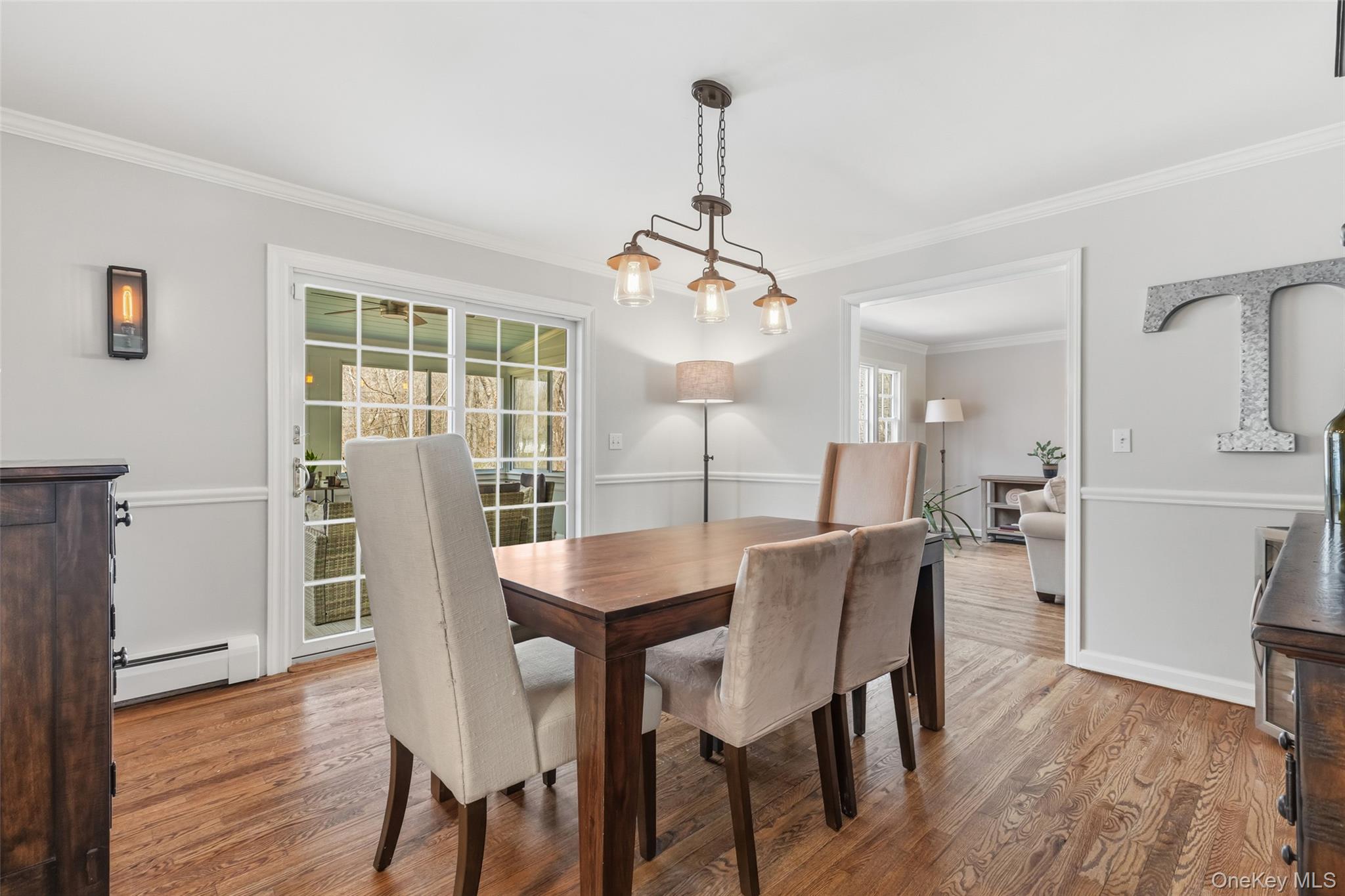 19 Deer Run Road South Salem, NY 10590 - Photo 8 of 43 Spacious dining room with doors to three-season room with electric stove
