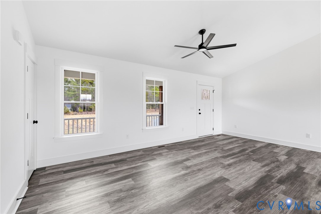 5245 Courtland Road Disputanta, VA 23842 - Photo 6 of 27 wooden floor in an empty room with a window