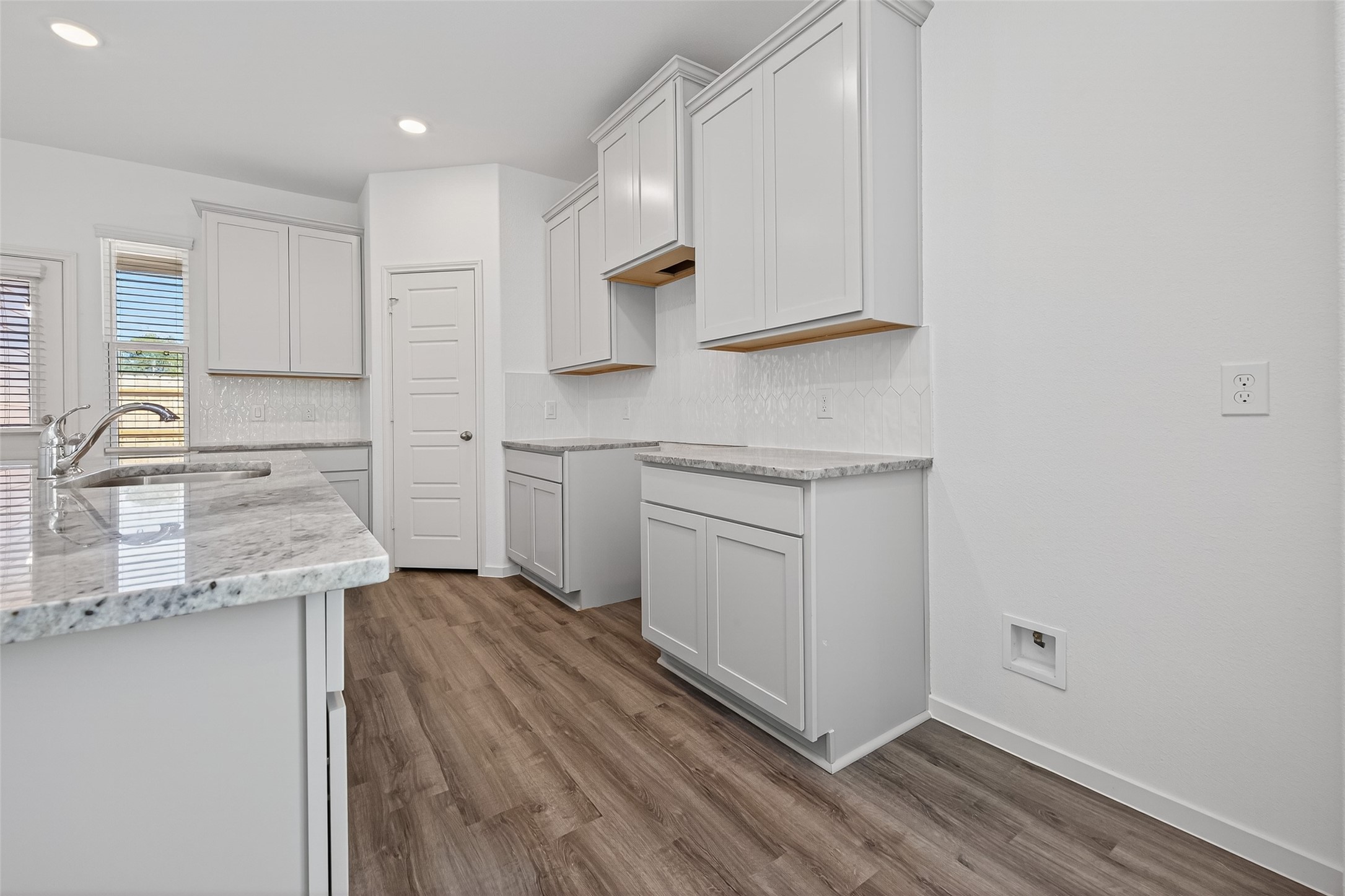 9734 Enclave Ridge Road Willis, TX 77318 - Photo 13 of 29 a kitchen with stainless steel appliances granite countertop a sink stove and cabinets