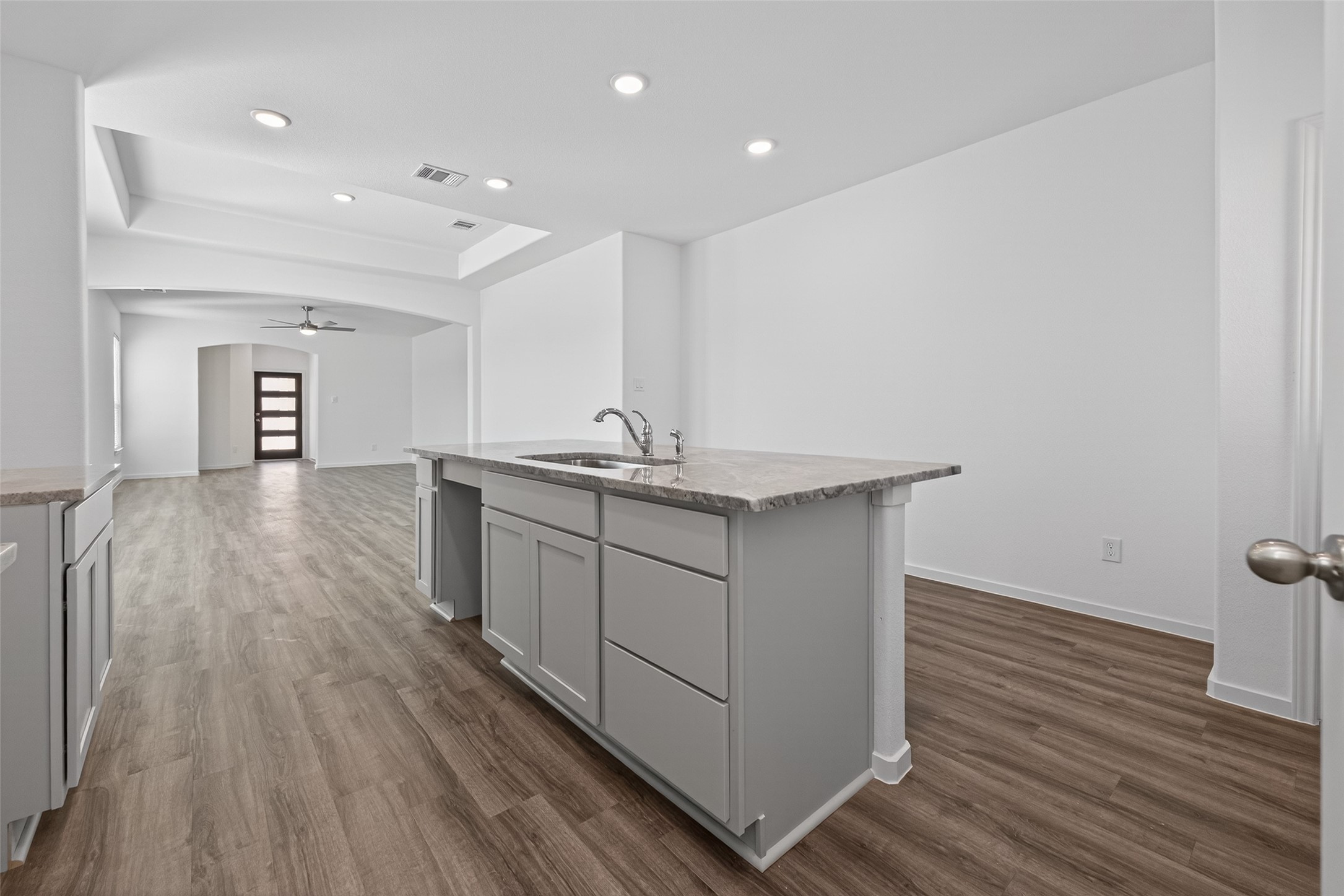 9734 Enclave Ridge Road Willis, TX 77318 - Photo 14 of 29 a kitchen with a sink and wooden floor