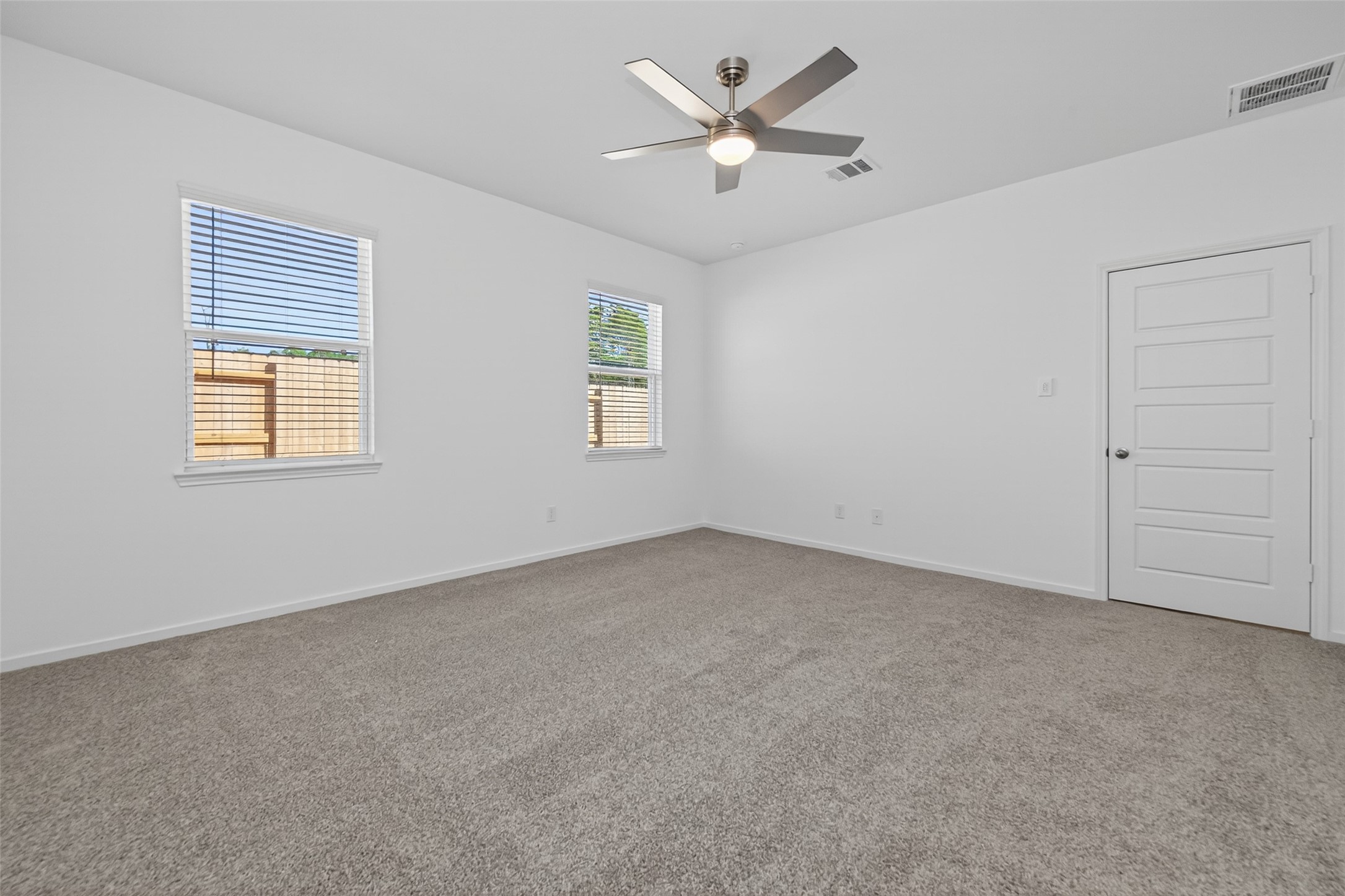 9734 Enclave Ridge Road Willis, TX 77318 - Photo 17 of 29 a view of an empty room with a window