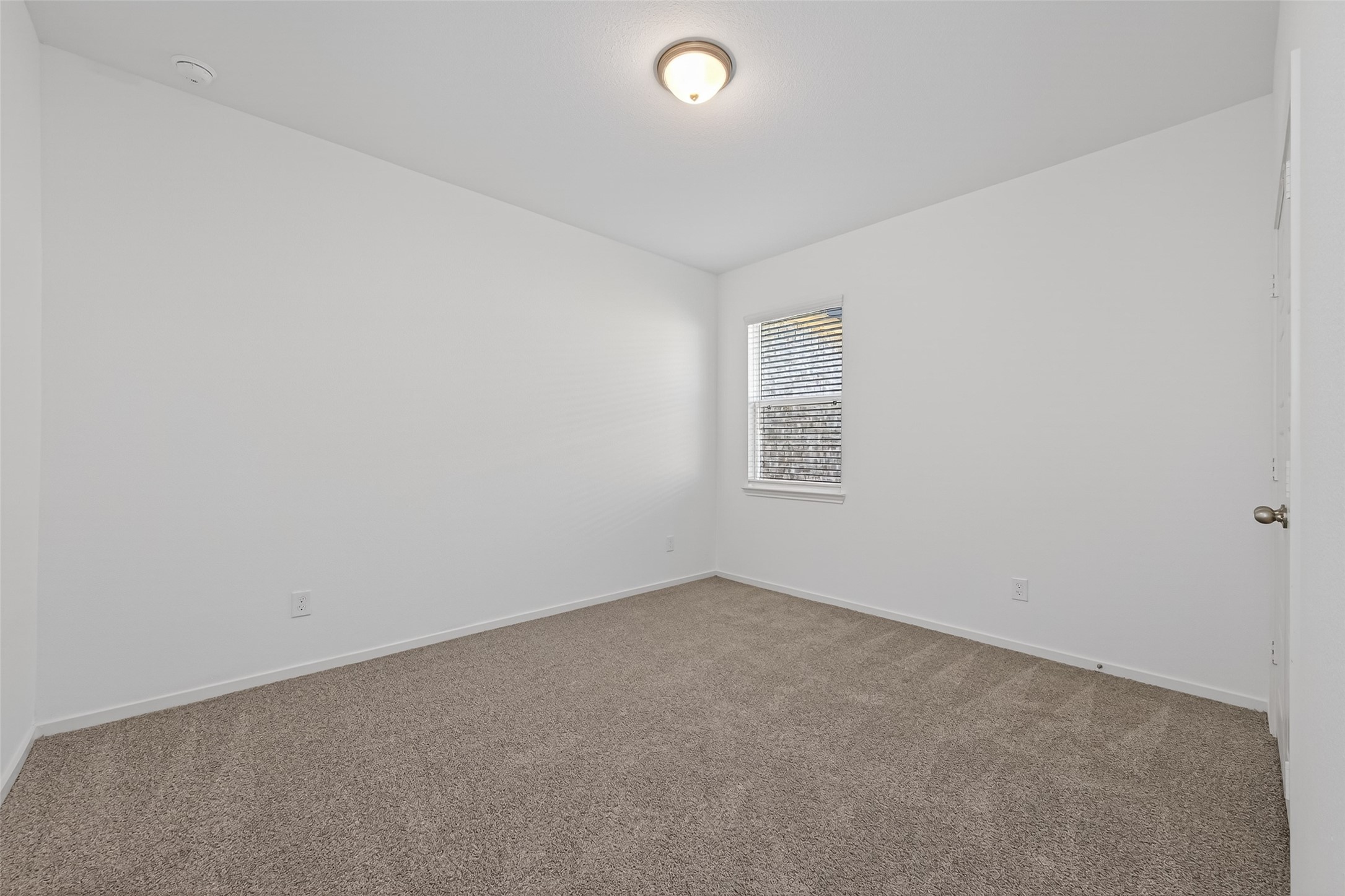9734 Enclave Ridge Road Willis, TX 77318 - Photo 22 of 29 an empty room with a window