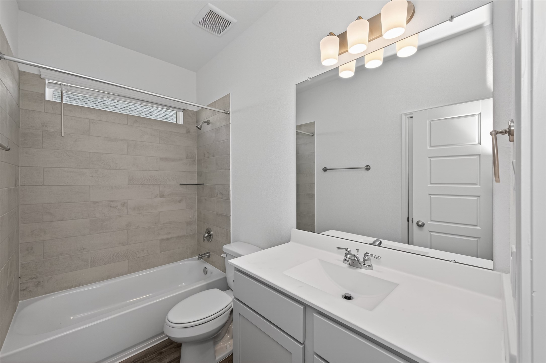 9734 Enclave Ridge Road Willis, TX 77318 - Photo 23 of 29 a bathroom with a sink a toilet and a mirror