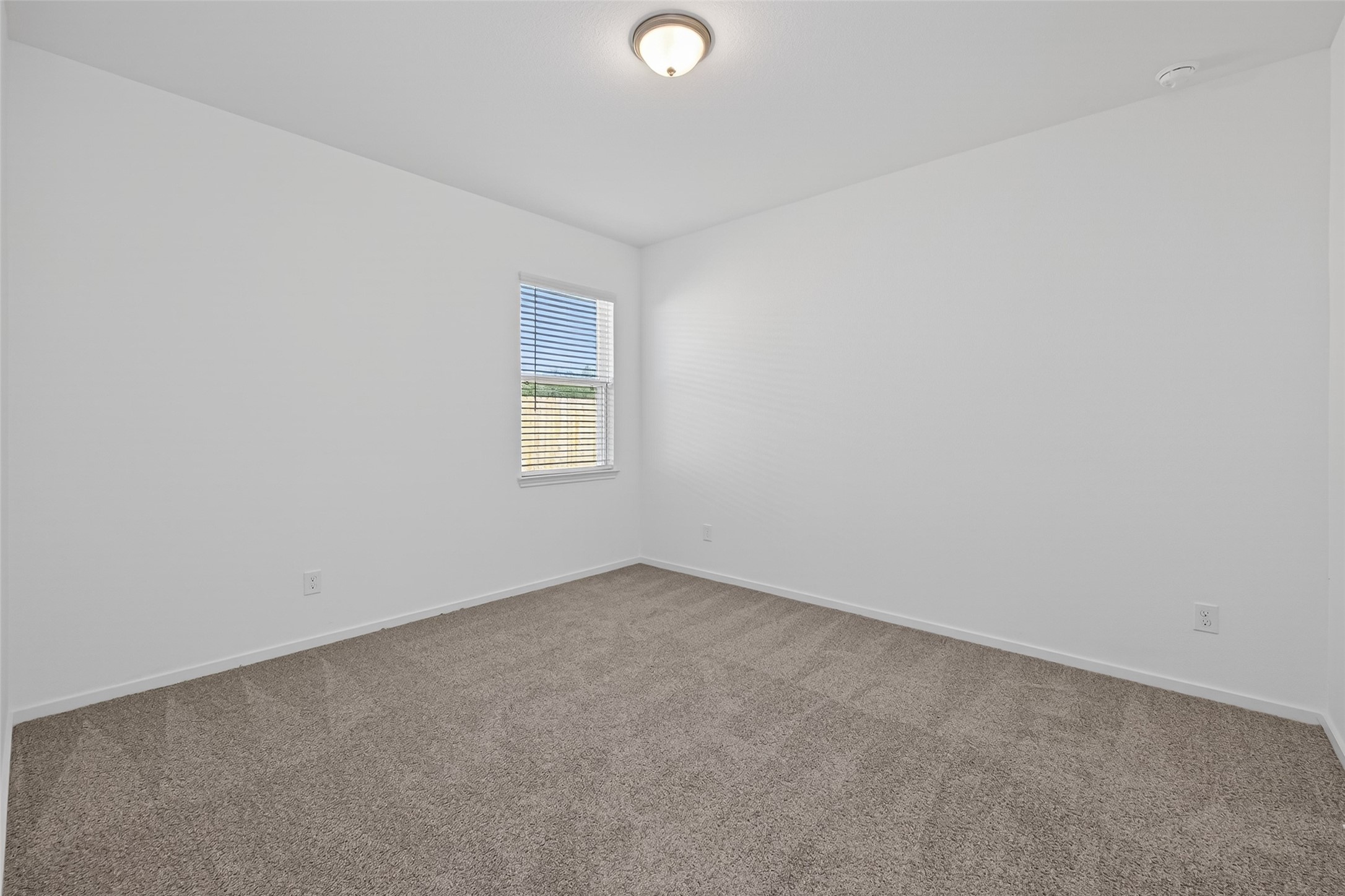 9734 Enclave Ridge Road Willis, TX 77318 - Photo 24 of 29 an empty room with a window