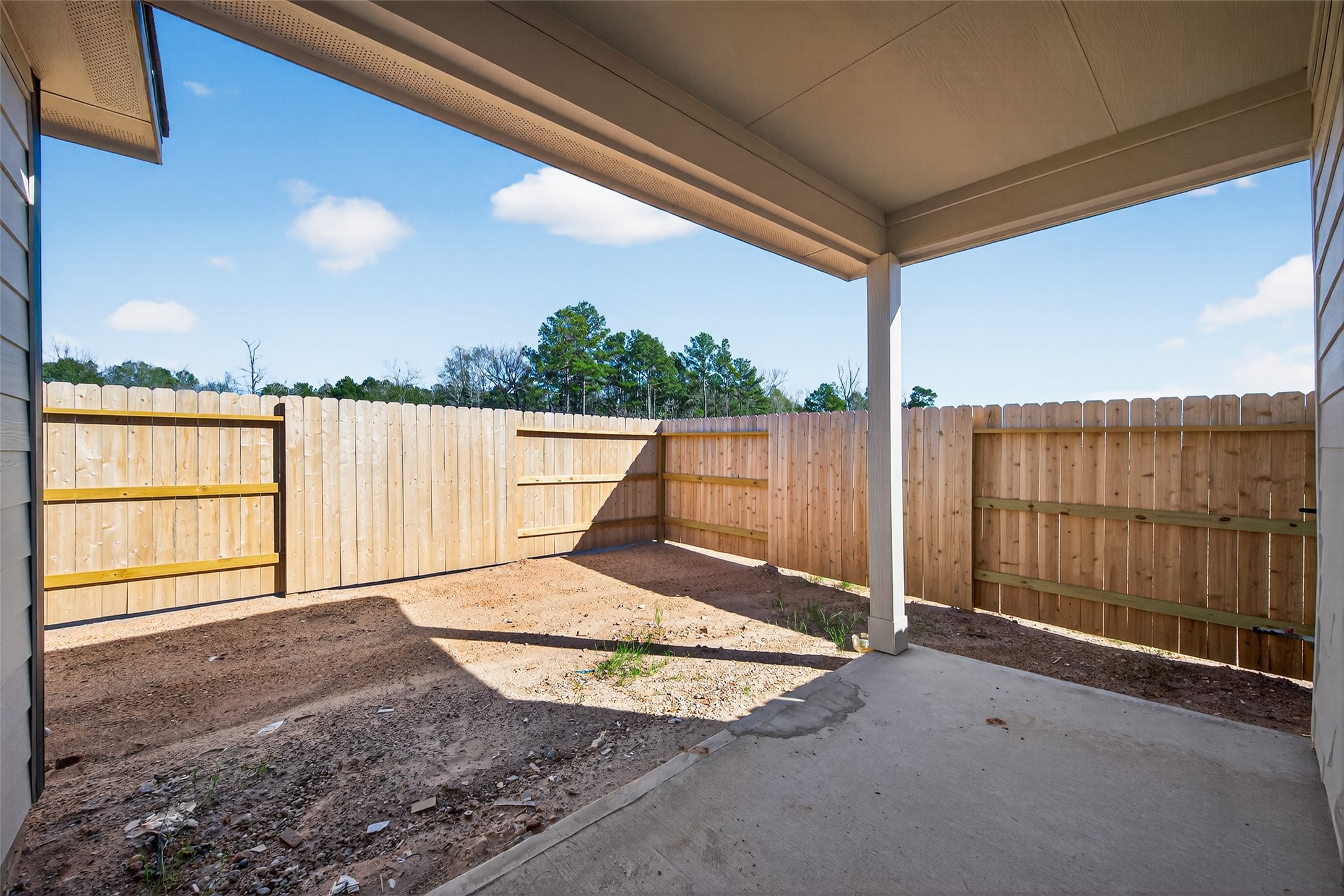 9734 Enclave Ridge Road Willis, TX 77318 - Photo 25 of 29 a view of a backyard