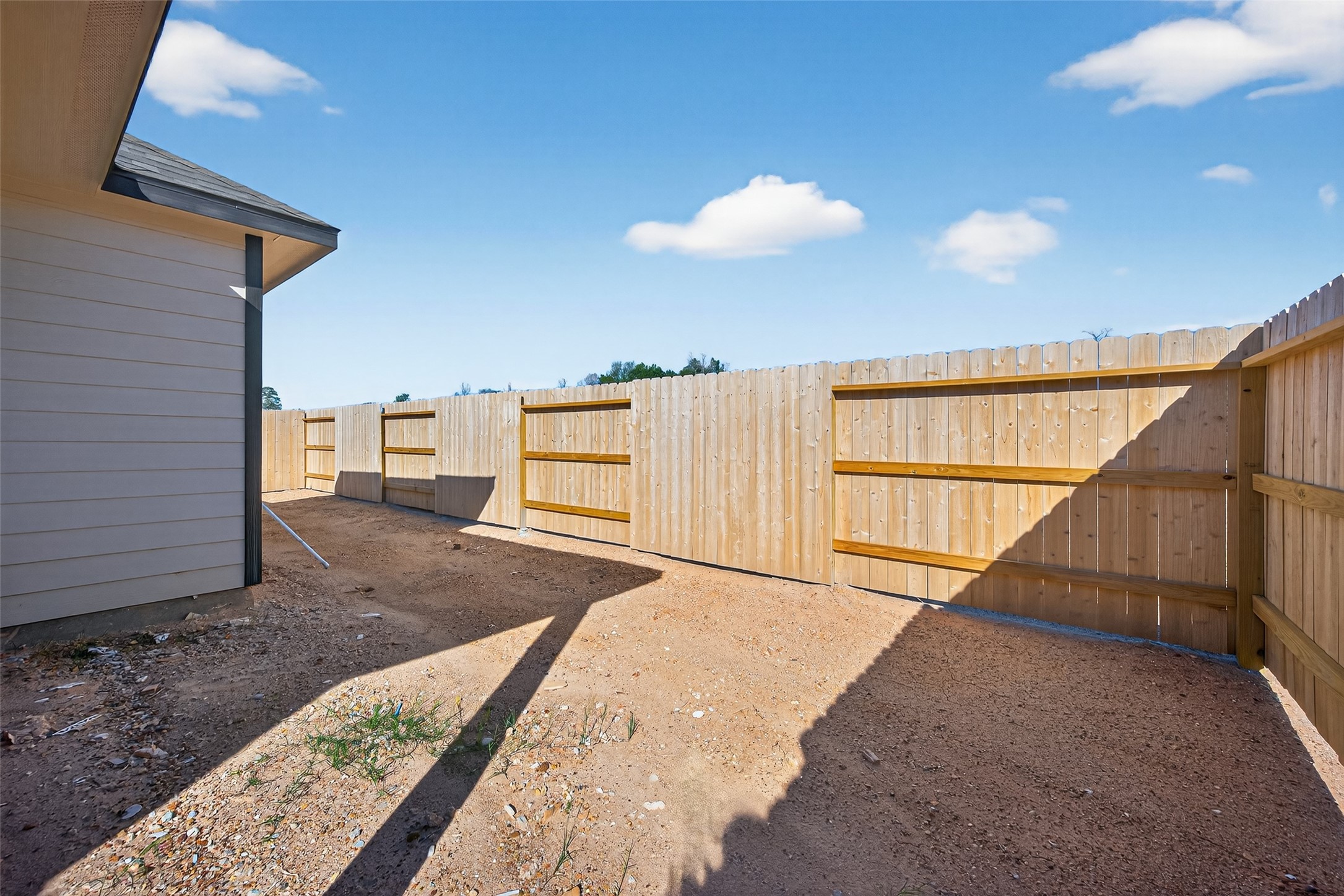 9734 Enclave Ridge Road Willis, TX 77318 - Photo 26 of 29 a view of a back yard