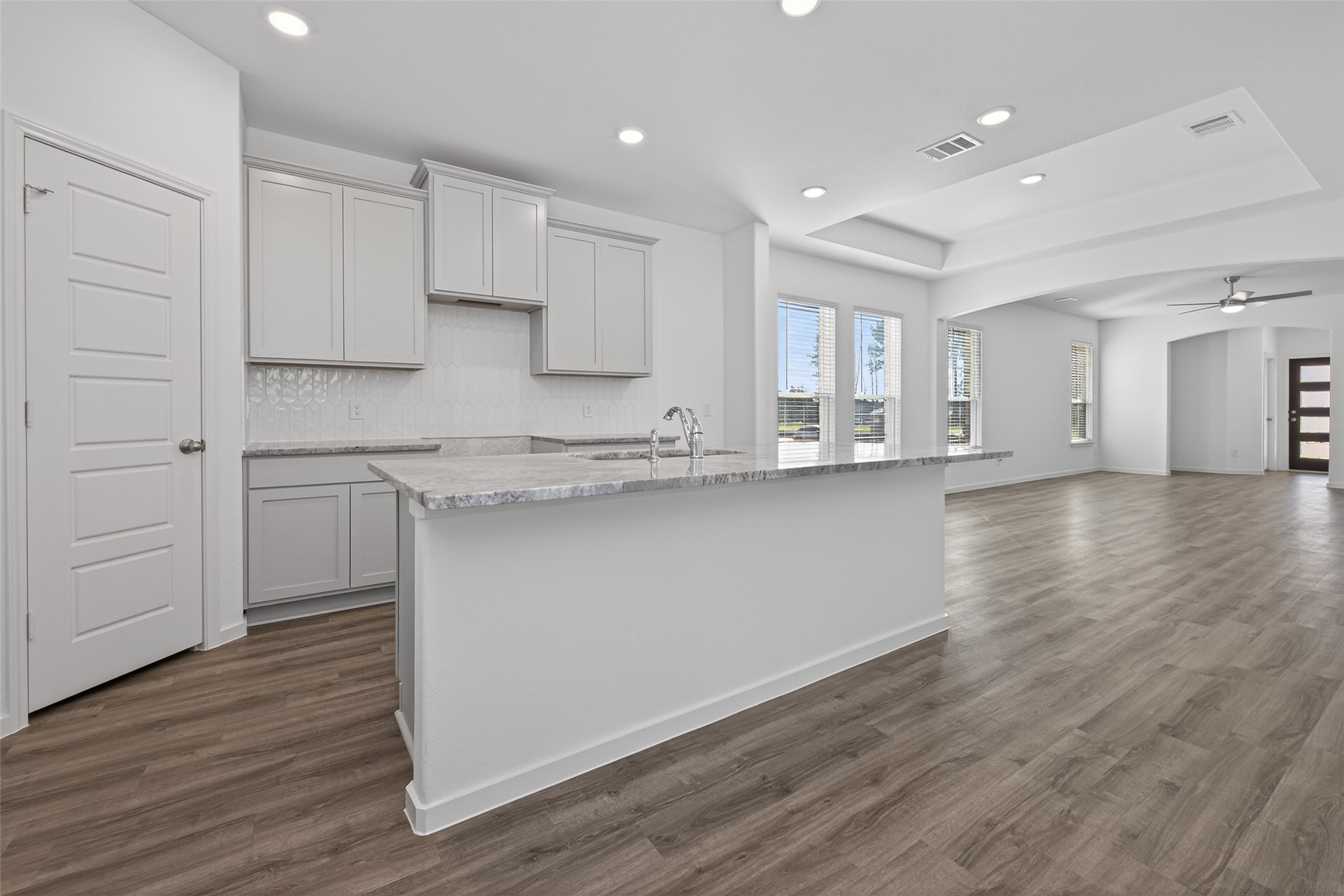 9734 Enclave Ridge Road Willis, TX 77318 - Photo 10 of 29 a kitchen with granite countertop white cabinets and a stainless steel appliances