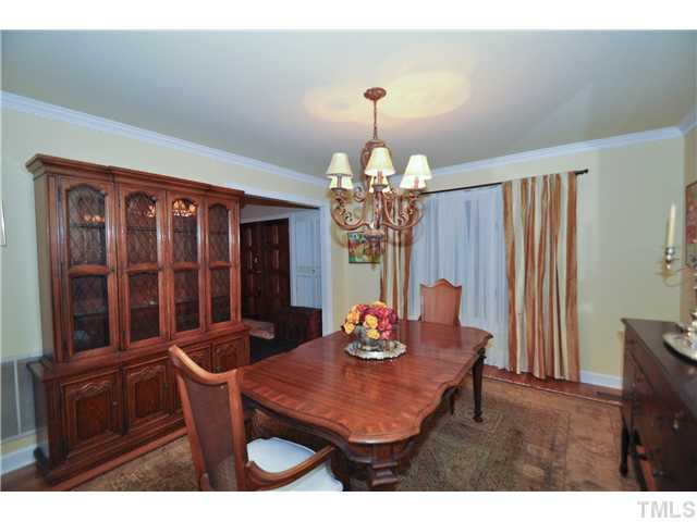 5409 Edington Lane Raleigh, NC 27604 - Photo 7 of 22 a view of a dining room with furniture window and wooden floor