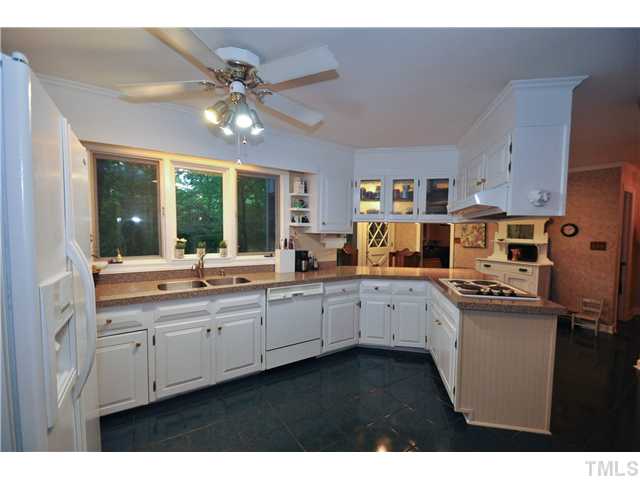 5409 Edington Lane Raleigh, NC 27604 - Photo 8 of 22 a kitchen with appliances a sink and cabinets