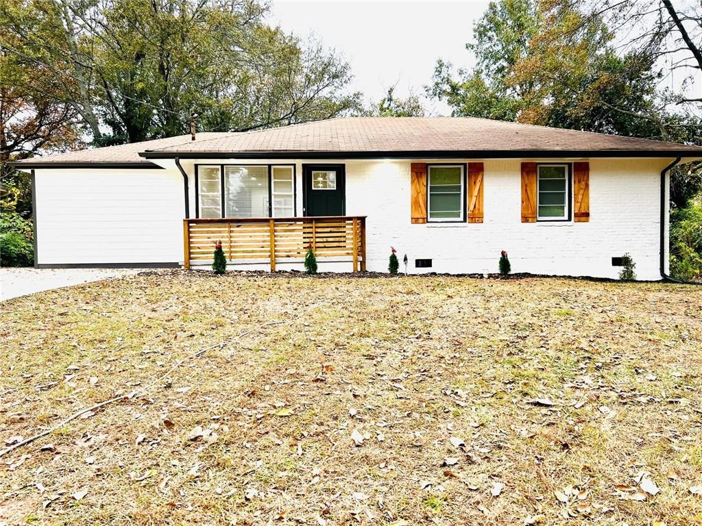 2072 Parker Ranch Road Southeast Atlanta, GA 30316 - Photo 1 of 1 a front view of a house with a garden