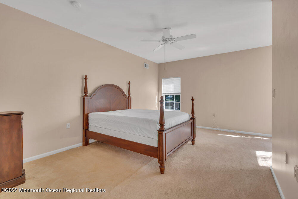 2 Ravenna Road Manchester Township, NJ 08759 - Photo 23 of 40 a bedroom with a bed and window