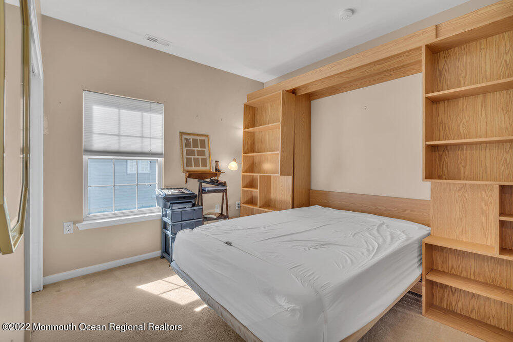 2 Ravenna Road Manchester Township, NJ 08759 - Photo 28 of 40 a bedroom with a bed and wooden floor