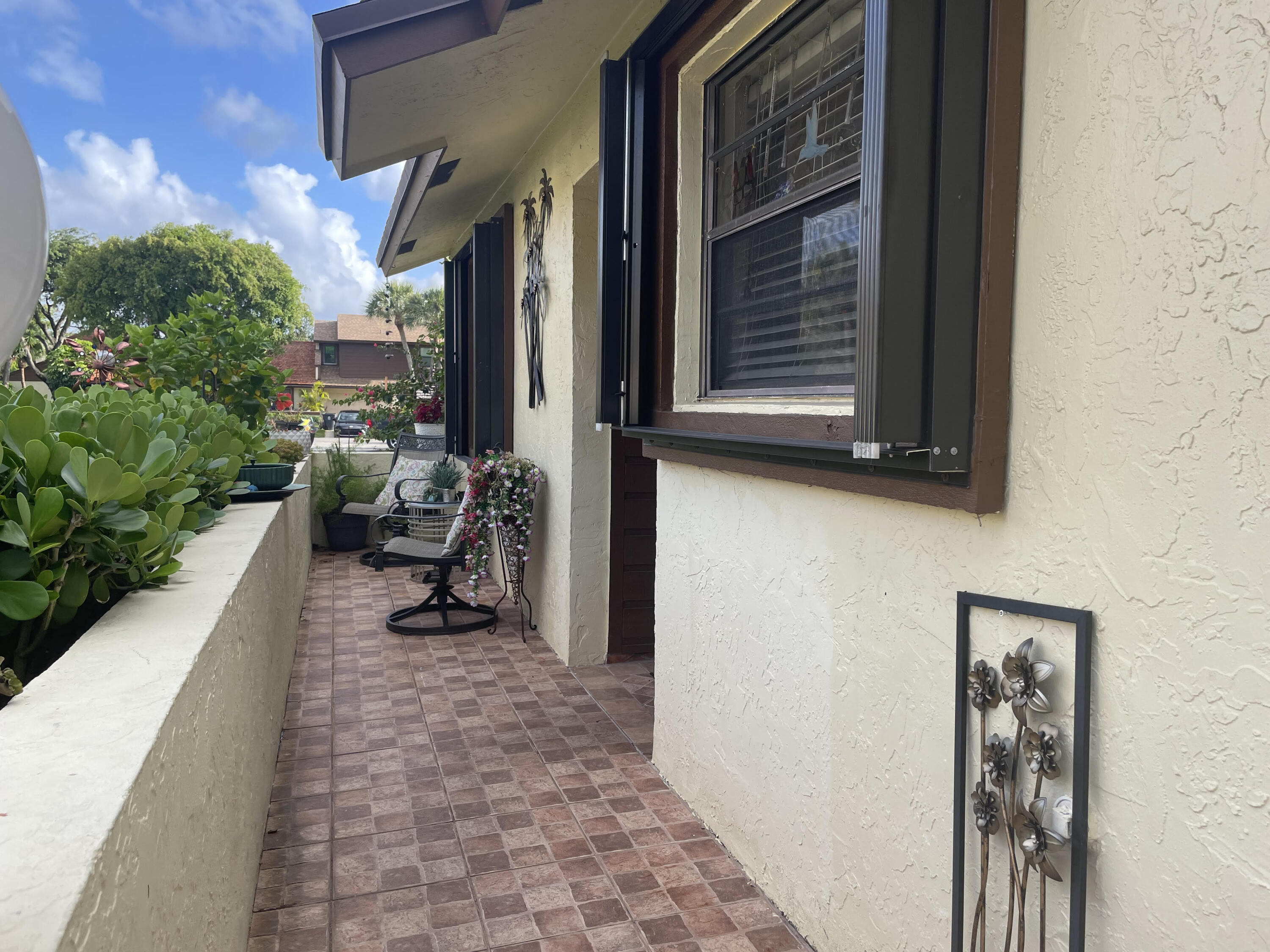 4403 Rende Lane Lake Worth, FL 33461 - Photo 3 of 14 a view of a porch with furniture