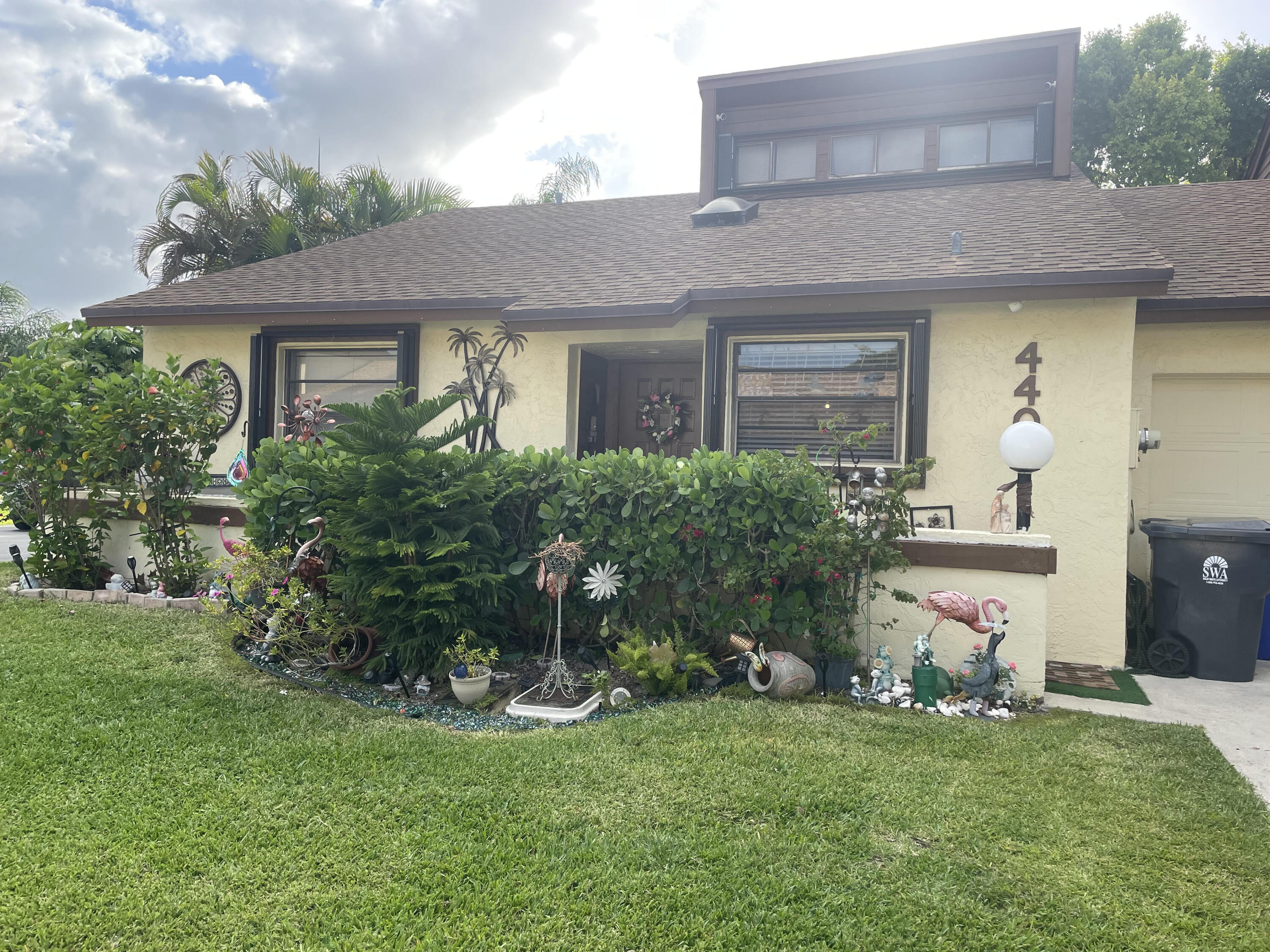4403 Rende Lane Lake Worth, FL 33461 - Photo 4 of 14 a front view of house with a garden