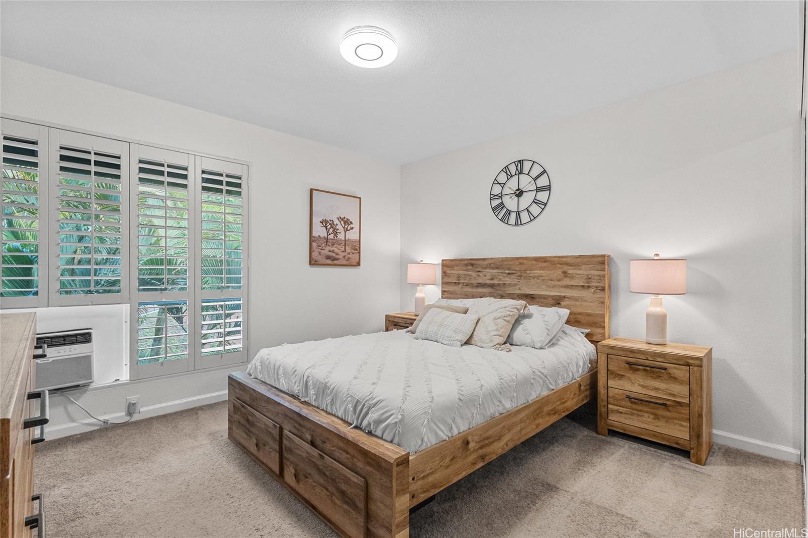 95-660 Wikao Street, Unit K304 Mililani, HI 96789 - Photo 12 of 24 a bedroom with a bed and a table