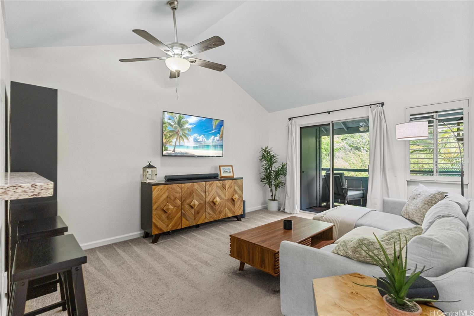 95-660 Wikao Street, Unit K304 Mililani, HI 96789 - Photo 2 of 24 a living room with furniture and a large window