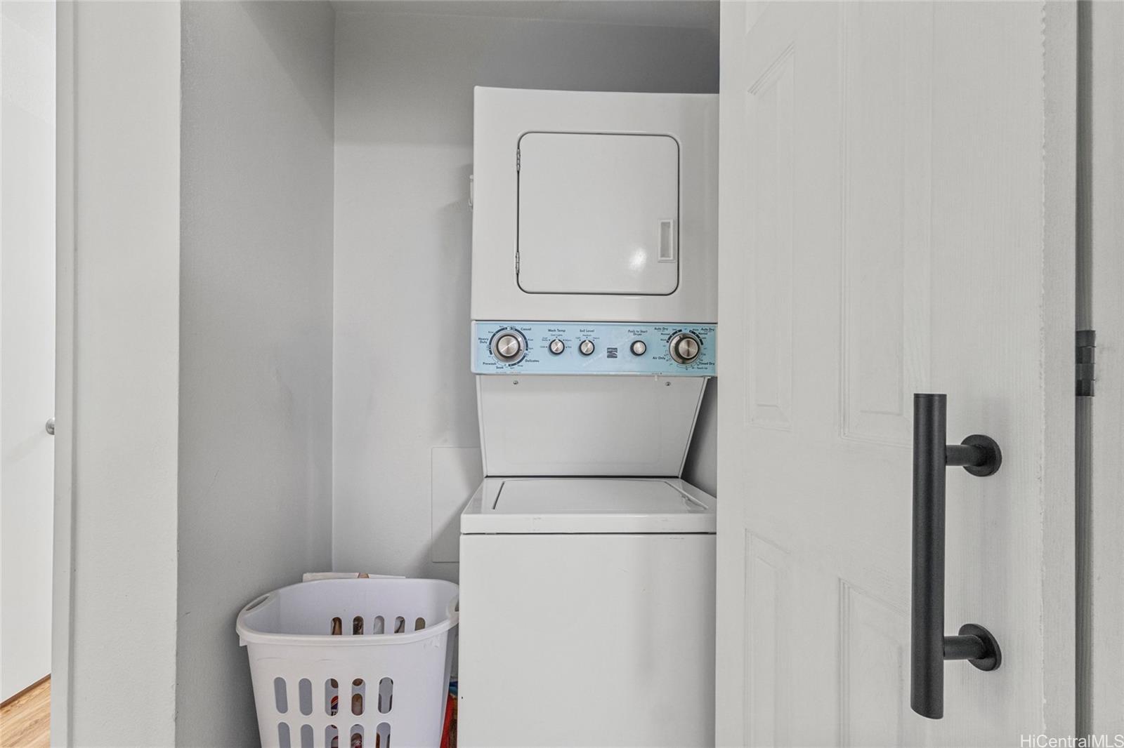 95-660 Wikao Street, Unit K304 Mililani, HI 96789 - Photo 10 of 24 a close view of a utility room with dryer and washer