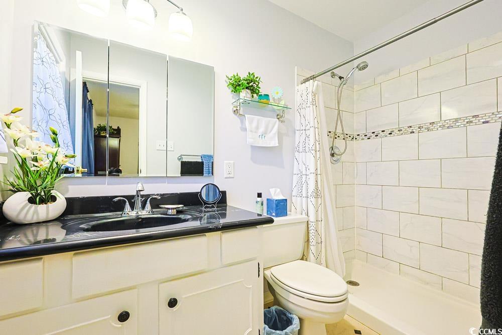 801 Talbot Circle Myrtle Beach, SC 29577 - Photo 18 of 40 Full bathroom with vanity and a stall shower