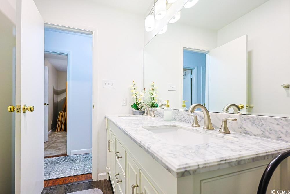 801 Talbot Circle Myrtle Beach, SC 29577 - Photo 26 of 40 Full bathroom featuring dark wood-style floors and double vanity