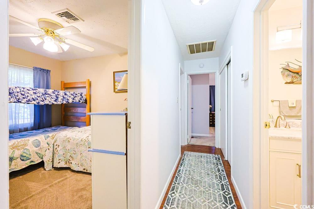 801 Talbot Circle Myrtle Beach, SC 29577 - Photo 30 of 40 Bedroom with a ceiling fan and light colored carpet