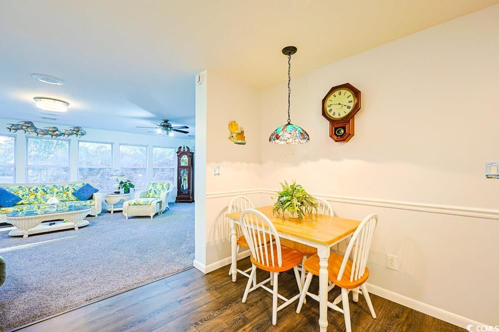 801 Talbot Circle Myrtle Beach, SC 29577 - Photo 31 of 40 Dining space featuring wood finished floors, a ceiling fan, and carpet flooring