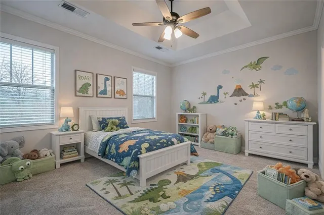 a bedroom with a bed and ceiling fan