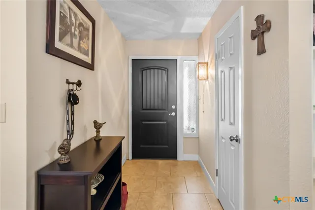 a bedroom with a bed and a mirror