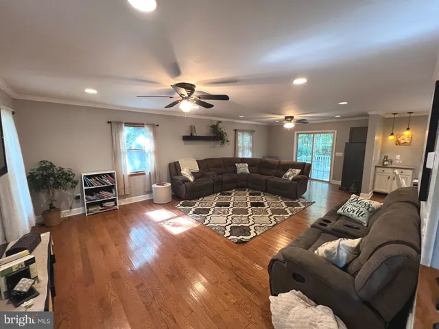 a view of a livingroom with furniture and a flat screen tv