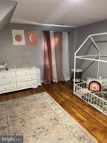 a bathroom with a sink vanity and toilet