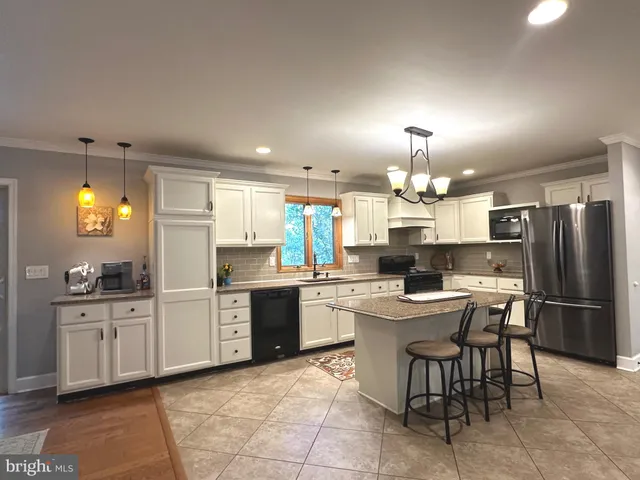 a kitchen with a sink and refrigerator