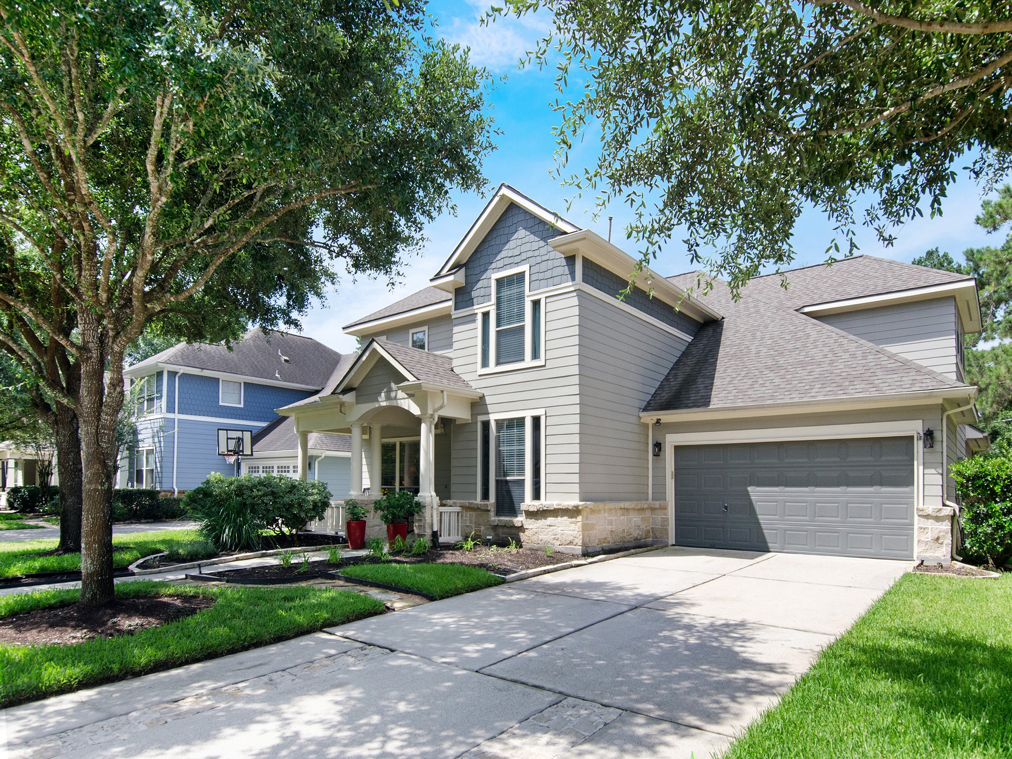 28323 Ryans Ridge Lane Spring, TX 77386 - Photo 40 of 45 Mature trees frame this attractive exterior, complimented by fresh paint (2022) a new roof (2023) and an oversized garage. A home you'll be proud to call your own!