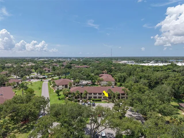 an aerial view of a house with yard