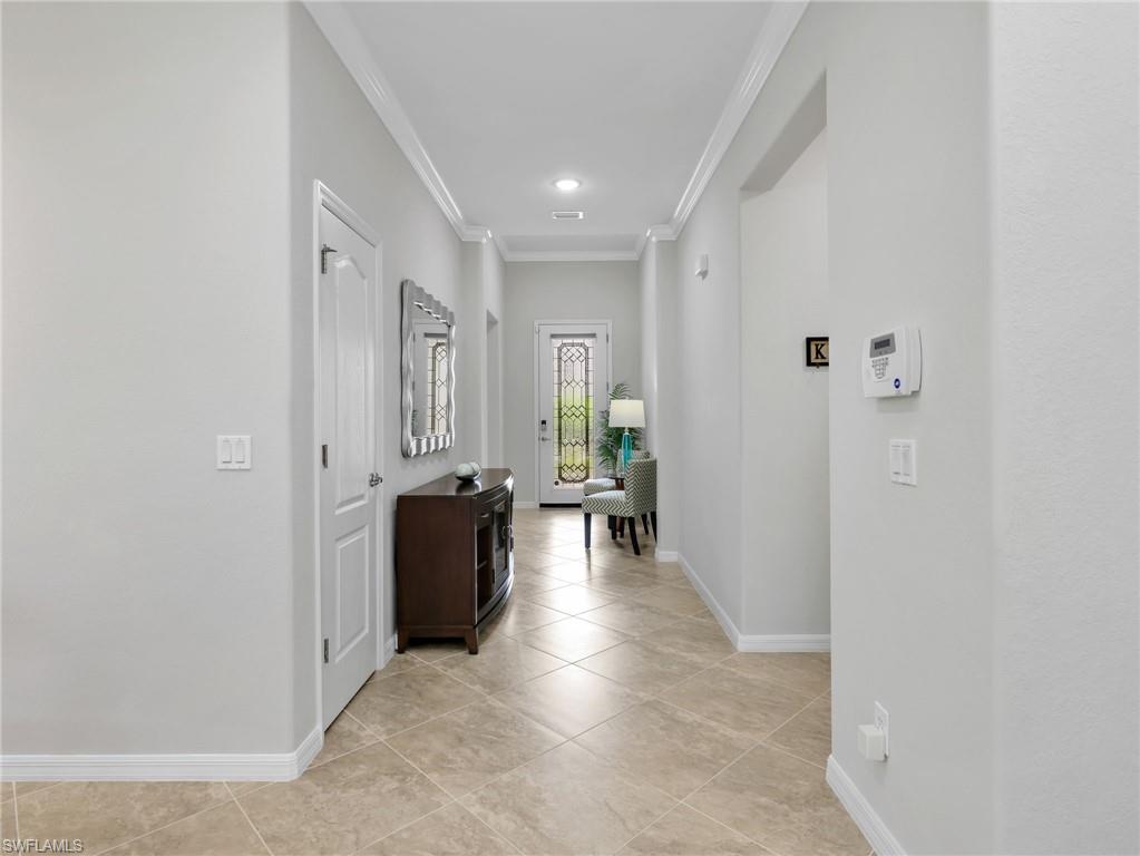 4383 Bismark Way Naples, FL 34119 - Photo 23 of 49 Front Entry Foyer with Crown Molding & Stained Glass Door