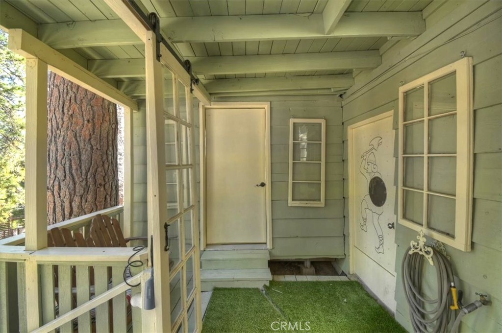2452 Spring Drive Running Springs, CA 92382 - Photo 25 of 33 Hallway to outside studio - bedroom 3