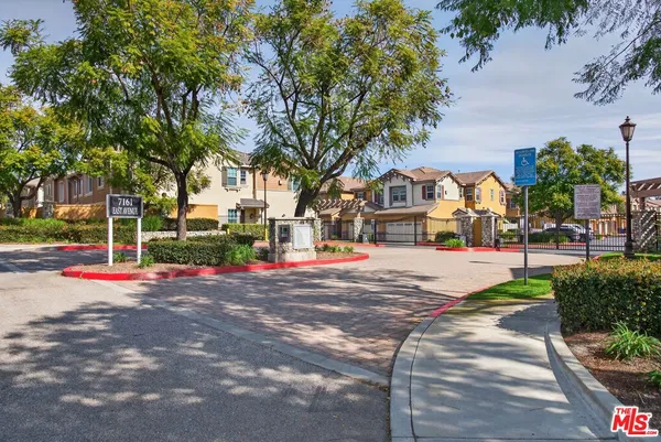 a view of road with houses