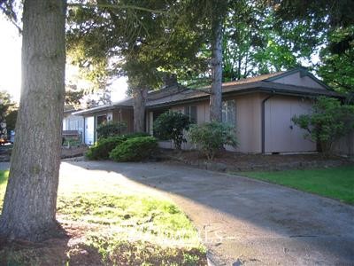 4624 Northeast 23rd Street Renton, WA 98059 - Photo 1 of 1 a backyard of a house with plants and trees