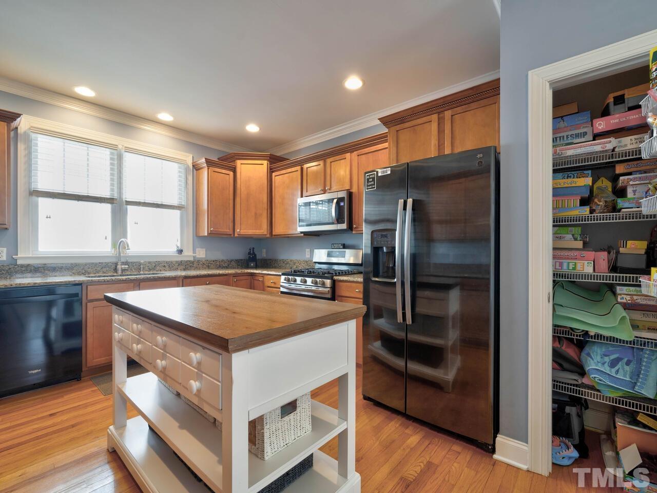 2228 Karns Place Raleigh, NC 27614 - Photo 13 of 62 a kitchen with stainless steel appliances granite countertop a refrigerator and a sink