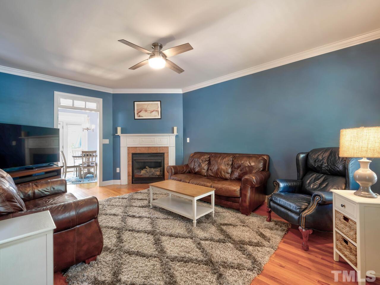 2228 Karns Place Raleigh, NC 27614 - Photo 18 of 62 a living room with furniture and a fireplace