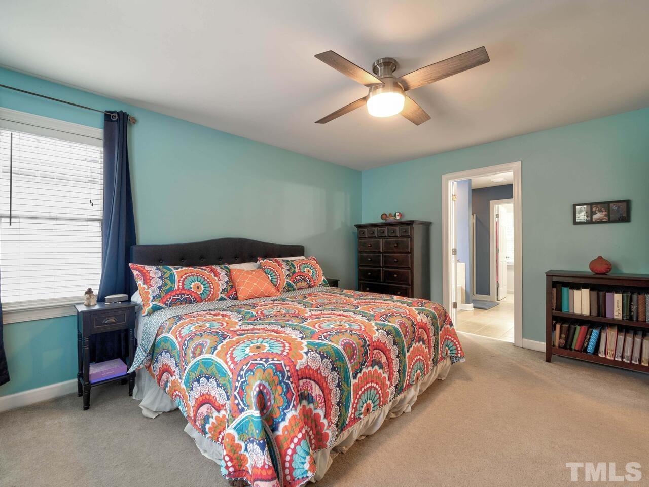 2228 Karns Place Raleigh, NC 27614 - Photo 23 of 62 a bedroom with a bed and a book shelf