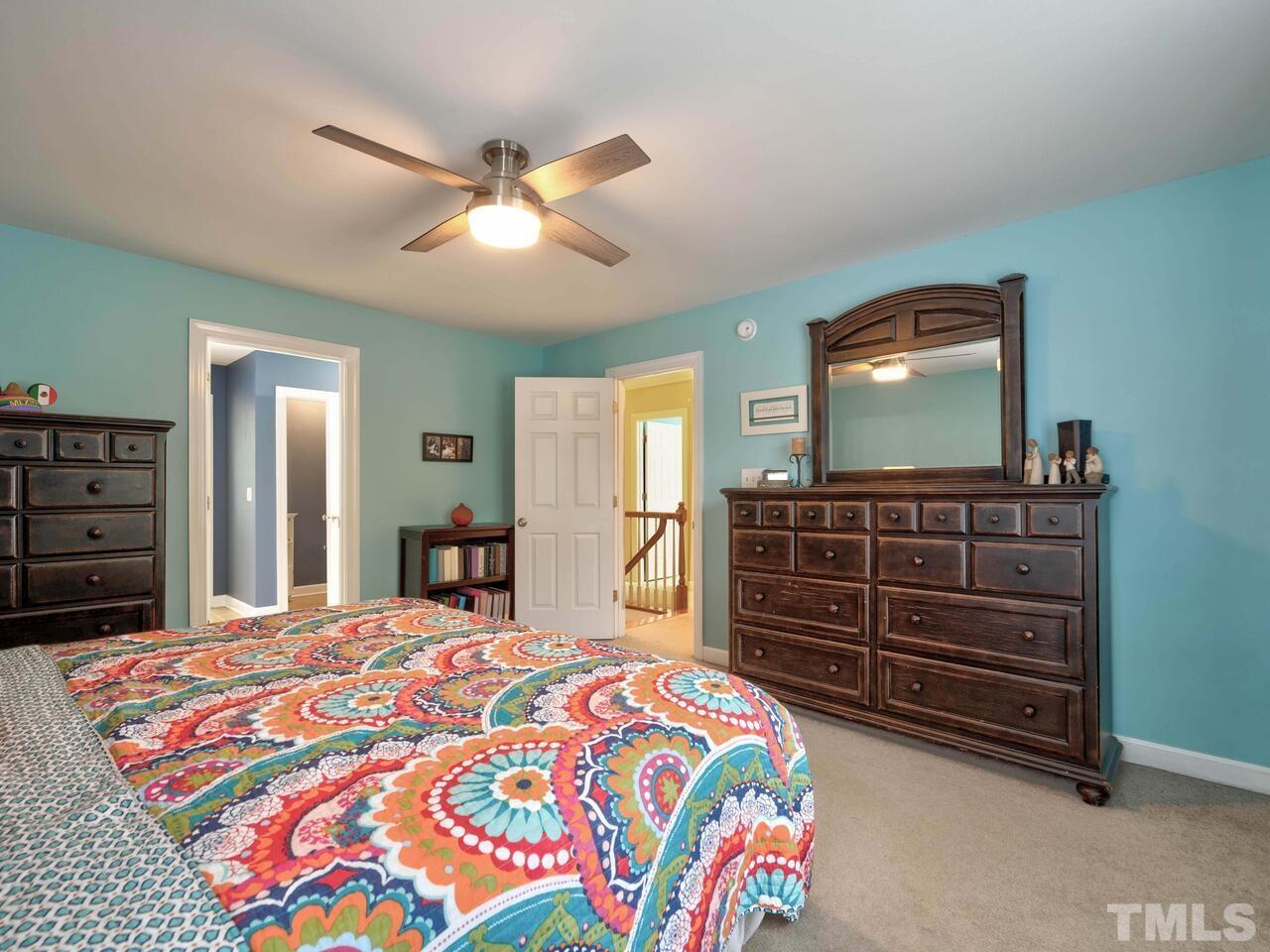 2228 Karns Place Raleigh, NC 27614 - Photo 24 of 62 a bedroom with a bed and a dresser