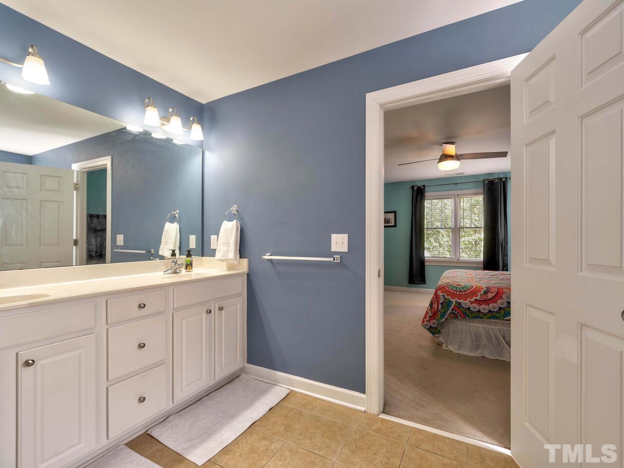 2228 Karns Place Raleigh, NC 27614 - Photo 26 of 62 a en suite bathroom with a sink and a mirror