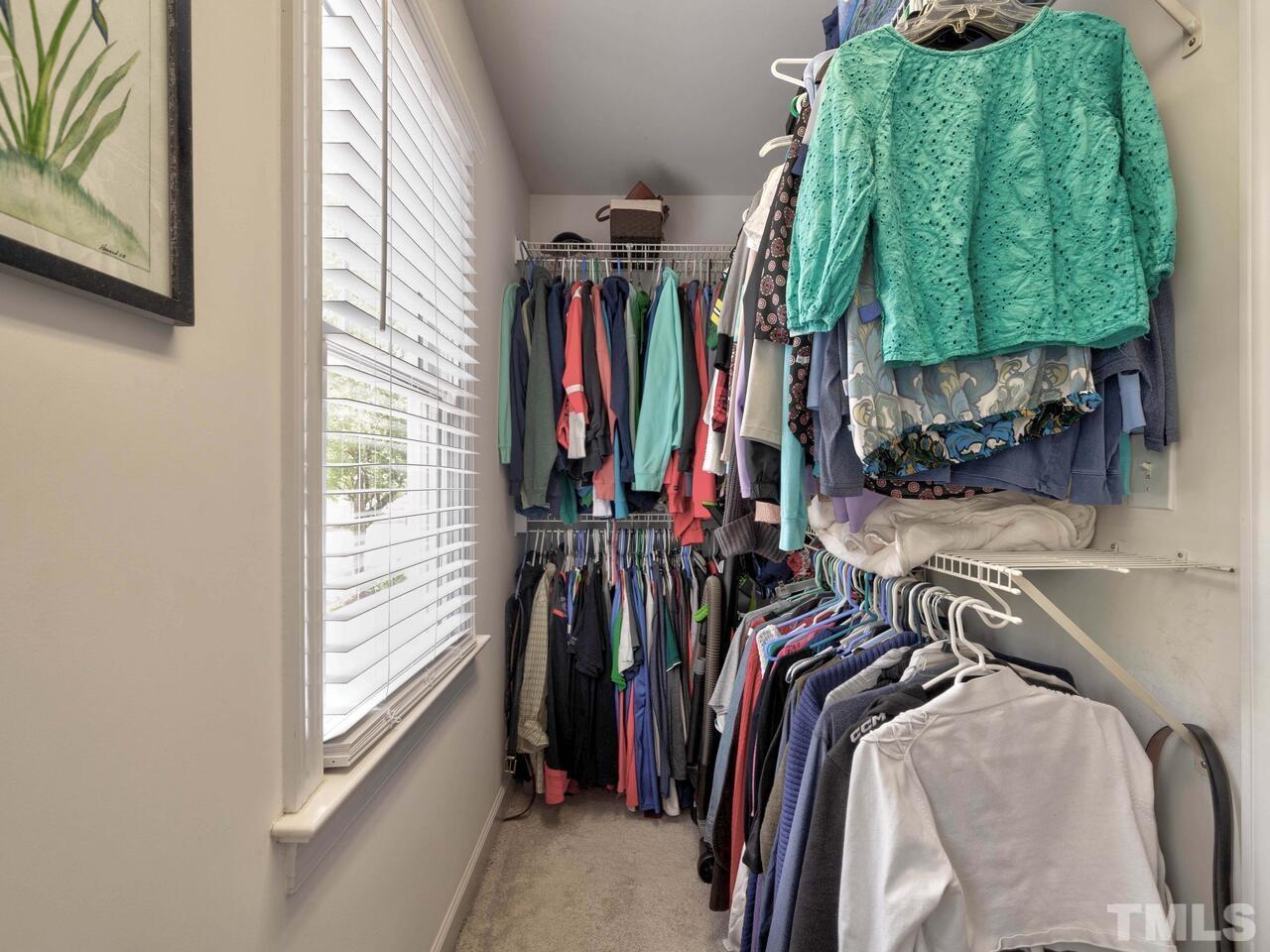 2228 Karns Place Raleigh, NC 27614 - Photo 28 of 62 a view of walk in closet with clothes and shoes