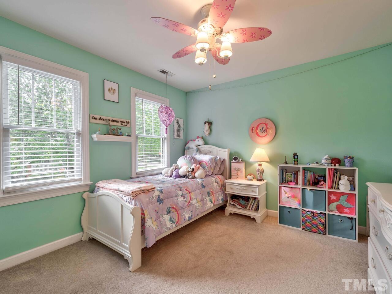 2228 Karns Place Raleigh, NC 27614 - Photo 32 of 62 a bed room with a bed and a chandelier