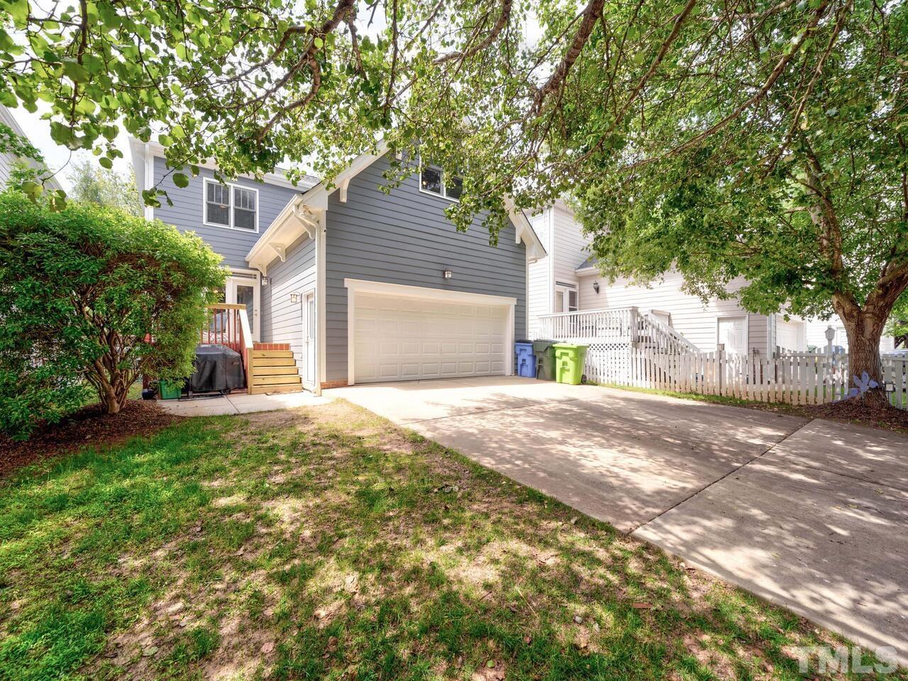 2228 Karns Place Raleigh, NC 27614 - Photo 45 of 62 a front view of a house with a yard and garage