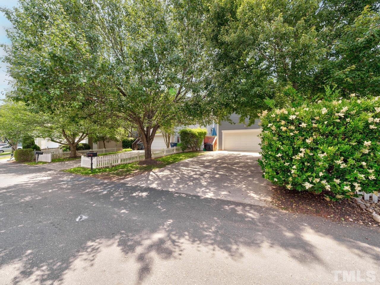 2228 Karns Place Raleigh, NC 27614 - Photo 48 of 62 a view of a house with a tree and plants