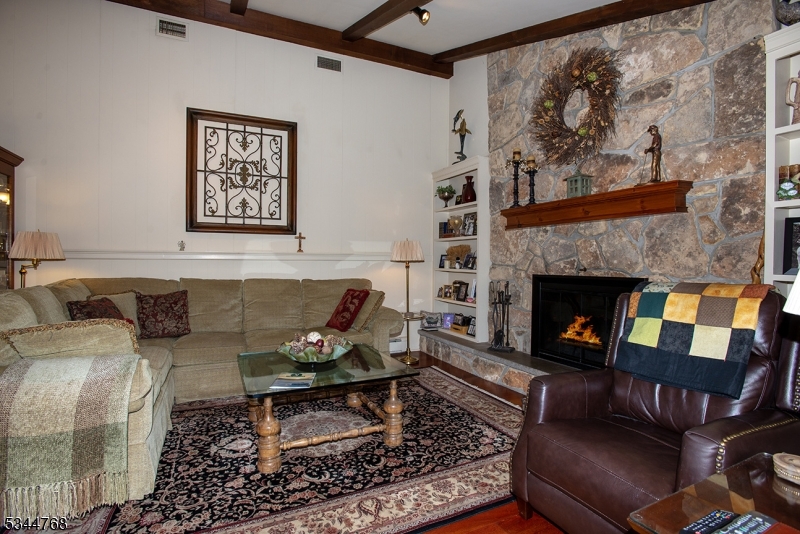 5 Marine Terrace Sparta, NJ 07871 - Photo 20 of 48 a living room with furniture and a fireplace