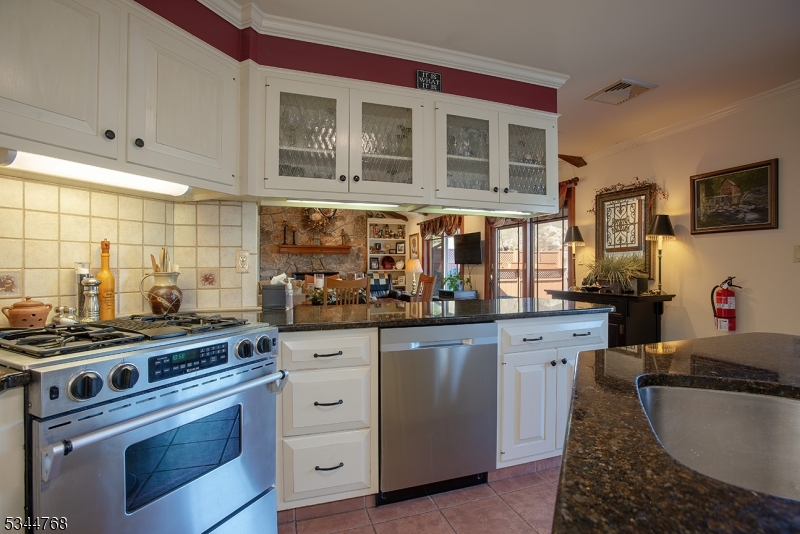 5 Marine Terrace Sparta, NJ 07871 - Photo 31 of 48 a kitchen with stainless steel appliances granite countertop a stove and a sink