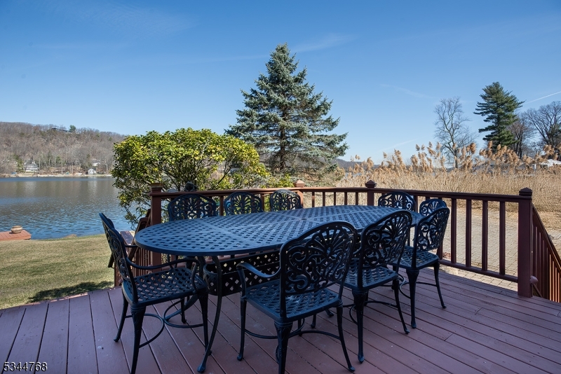 5 Marine Terrace Sparta, NJ 07871 - Photo 35 of 48 a balcony with wooden floor table and chairs